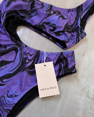 ASYMMETRICAL BODYSUIT WITH PURPLE STREAKING